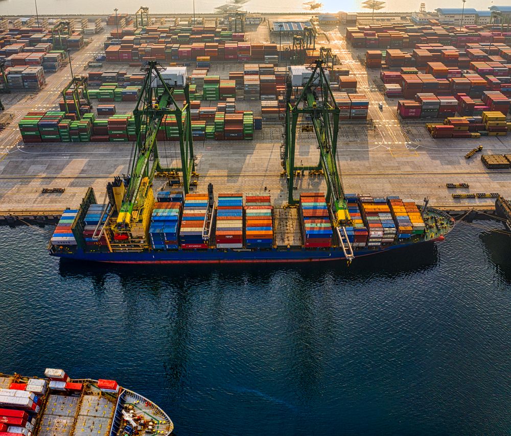 Aerial view of cargo shipping containers at a busy port