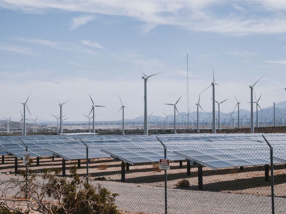 Wind turbines and solar panels representing the energy sector